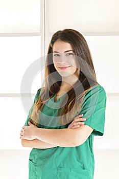 Portrait of happy smiling young female doctor