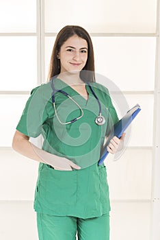 Portrait of happy smiling young female doctor