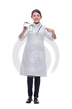 Portrait of happy smiling young female doctor showing blank business card or invitation