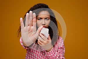 Portrait of a happy smiling young girl stalked and harassed in teenager cyber bullying concept