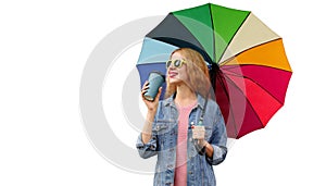 Portrait happy smiling young woman with colorful umbrella and cup of coffee looking away isolated on white background