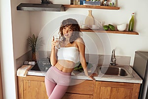 Portrait Of Happy Smiling Young Woman With Glass Of Fresh Water