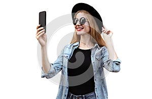 Portrait of happy smiling young woman with smartphone wearing black round hat isolated on white background