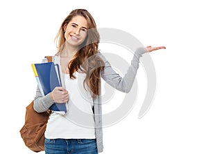 Portrait of happy student showing something isolated on white ba