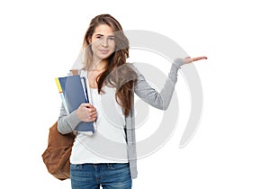 Portrait of happy student showing something isolated on white ba