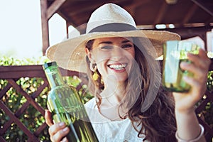Portrait of happy stylish woman in white shirt