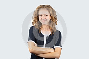 Portrait of happy teenage girl with curly hair smiling