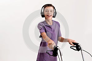 Portrait of happy teenaged disabled boy with cerebral palsy in headphones smiling at camera, taking steps with his