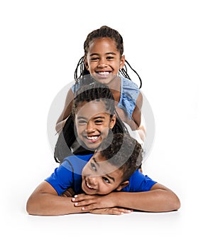 Portrait of happy three black childrens, white background