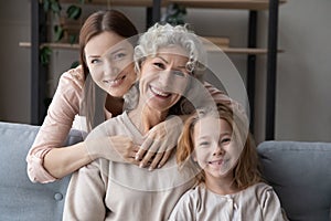 Portrait of happy three female generations family.