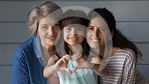 Portrait of happy three generations of Latino women photo