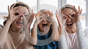 Portrait of happy three generations of women have fun