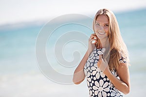 Portrait of a happy woman at the beach