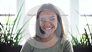 Portrait of happy woman with beautiful smile indoors