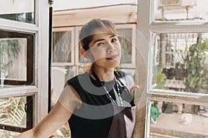 Portrait of happy woman cafe and restaurant owner with face mask.