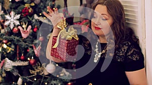 Portrait of a happy woman on a christmas tree background