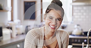 Portrait of a happy woman drinking coffee while relaxing and enjoying free time at home. Young, carefree female enjoying