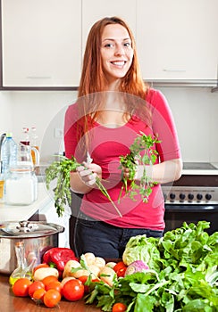Portrait of happy woman with fresh vegetables