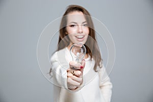 Portrait of a happy woman holding bulb