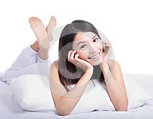 Portrait of happy woman smile face lying on bed