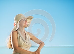 Portrait of happy woman standing on balcony