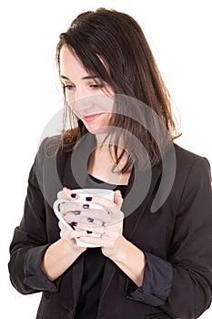 Portrait of a happy woman thinking and looking away with cup of tea or coffee