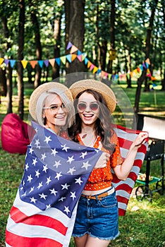 portrait of happy women with american flag