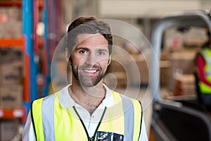 Portrait of happy worker is posing face to the camera