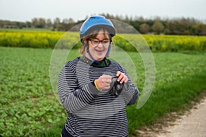 Portrait of a happy 40 yo woman with the Down Syndrome in the fields of Tienen, Belgium photo