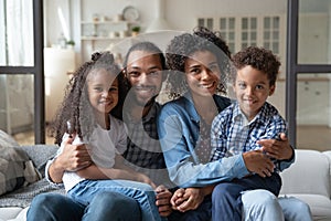 Portrait of happy young African American family.