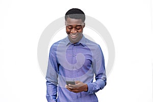 Happy young african american man looking at cellphone against isolated white background