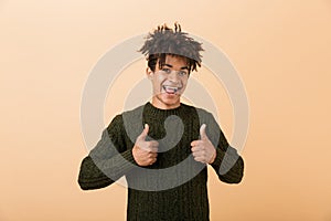 Portrait of a happy young african man dressed in sweater