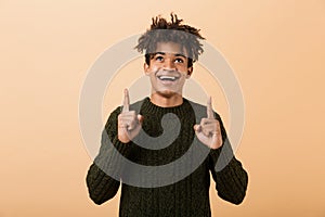 Portrait of a happy young african man dressed in sweater