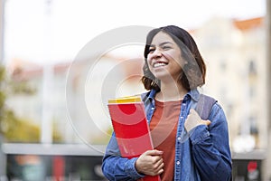 Portrait Of Happy Young Arab Student Woman Standing Outdoors