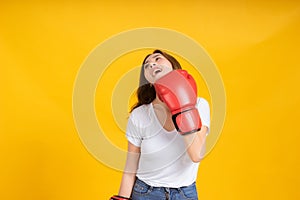 Portrait happy young asian woman with boxing glove  self business knock out