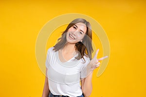 Portrait happy young asian woman laughing finger hands v-symbol gesture selfie