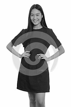 Portrait of happy young beautiful Asian teenage girl smiling