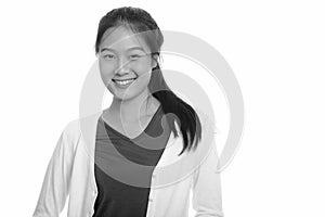 Portrait of happy young beautiful Asian teenage girl smiling