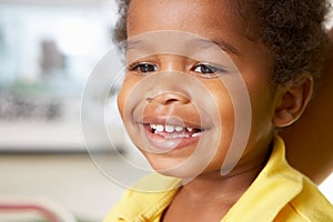 Portrait Of Happy Young Boy At Home