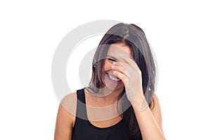 Portrait of a happy young brunette woman laughing