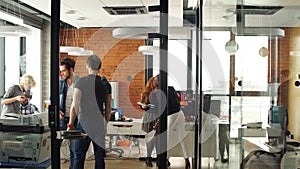 Portrait of happy young business team in modern office. Work in loft interior.