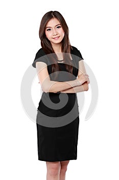 Portrait of a happy young business woman standing with folded ha