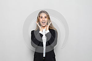 Portrait of happy young business woman surprised isolated on white background