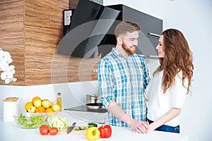 Portrait of happy young couple on the kitchen