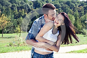 Portrait of happy young couple looking at each other.