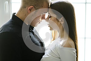 Portrait of happy young couple looking at each other and smiling. relationship between people