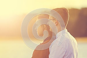 Portrait of happy young couple in love on blurred background of