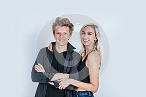 Portrait of happy young couple love together with flower in studio