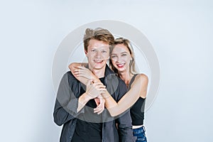 Portrait of happy young couple love together with flower in studio