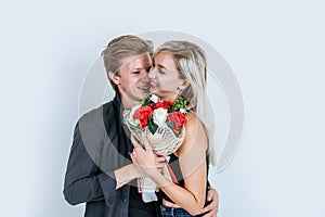 Portrait of happy young couple love together with flower in studio